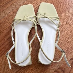 Yellow strappy heeled sandals